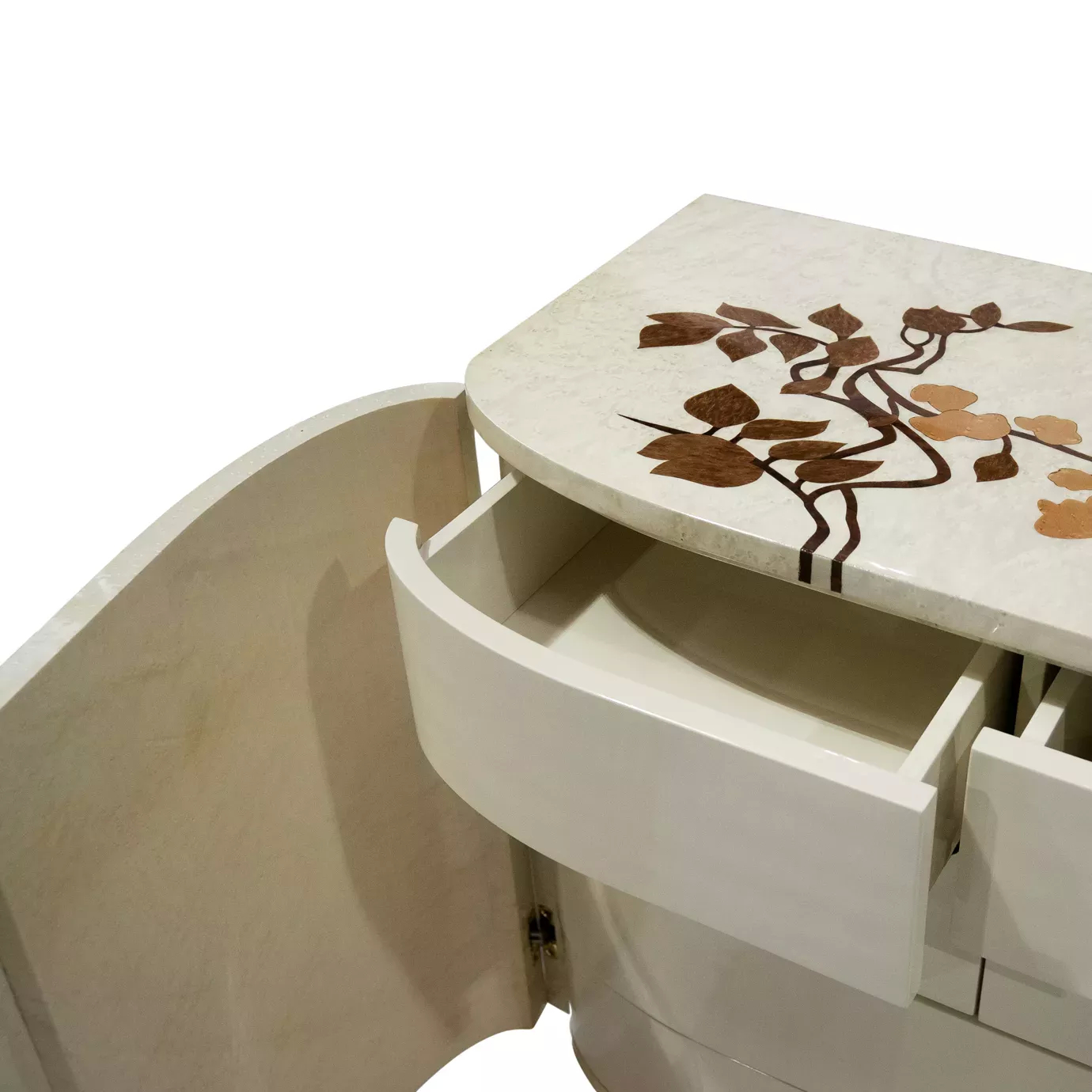 Elegant close-up of the Fleur Nightstand with an open drawer revealing its interior, also showing the cream-white finish and the delicate floral pattern in shades of brown and gold on the top and the slightly open side door.