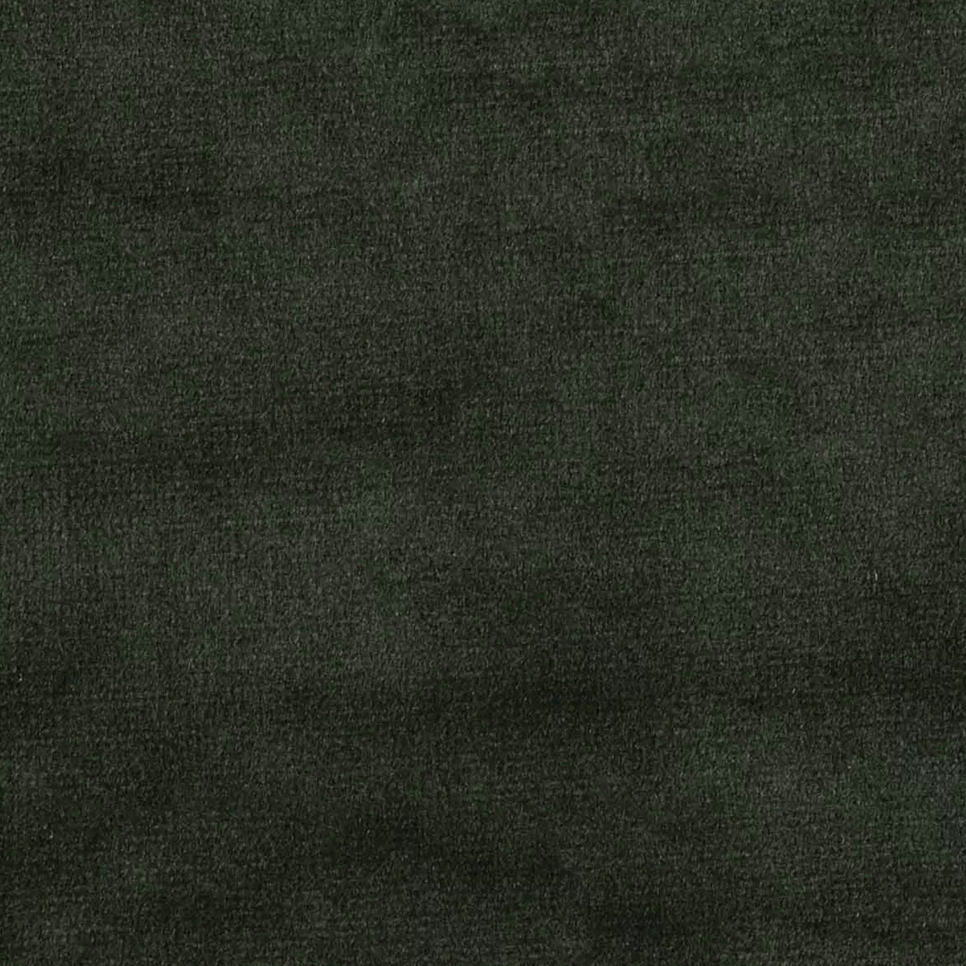 Elegant close-up of a Radiance Velvet fabric swatch in a deep and sophisticated dark green tone, showcasing its velvety texture and a subtle sheen that gives it a feeling of depth and elegance.