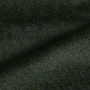 Elegant close-up of a Radiance Velvet fabric swatch in a deep and rich forest green tone, showcasing its velvety texture and the gentle folds that give it a feeling of luxury and depth.