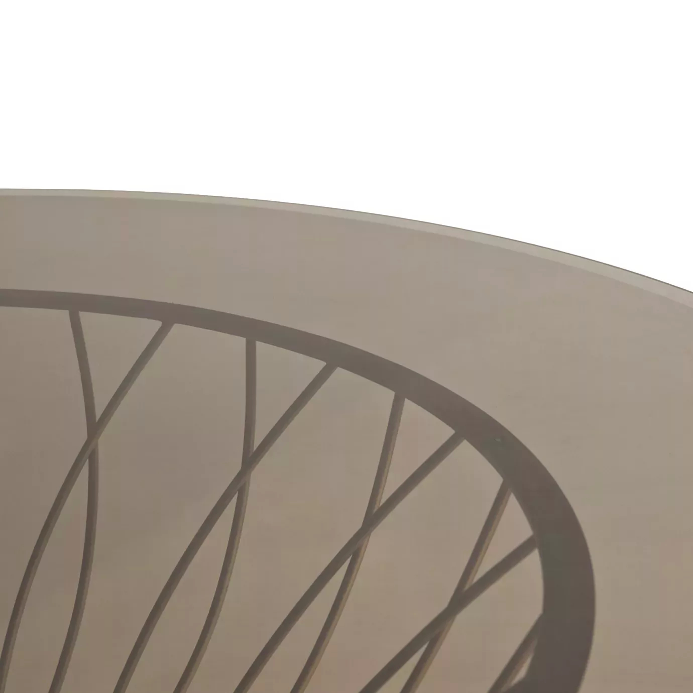 Detailed view of the Allure Dining Table’s bronze glass tabletop, with the golden structure underneath.