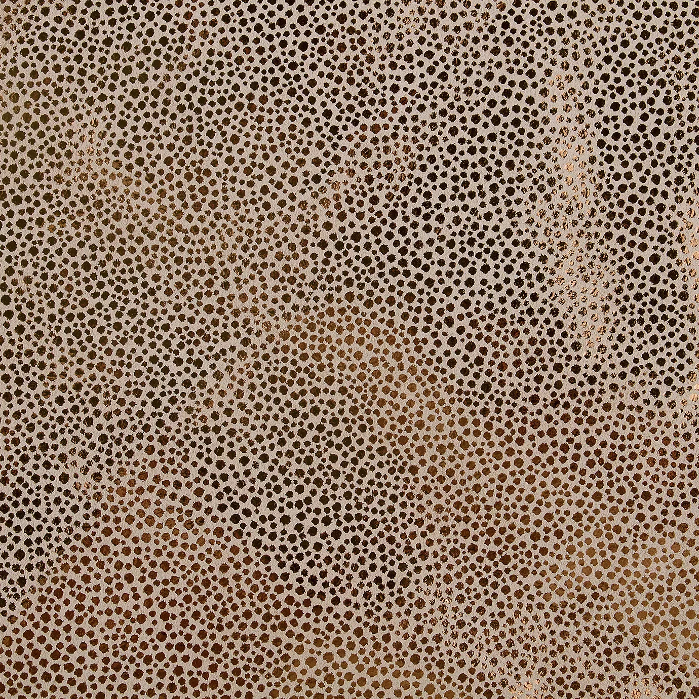 Elegant close-up of a Crico Leather swatch with a textured pattern of small dots in beige and metallic copper tones, featuring a smooth surface with a warm shimmer, evoking a feeling of textured sophistication and a touch of luminosity.