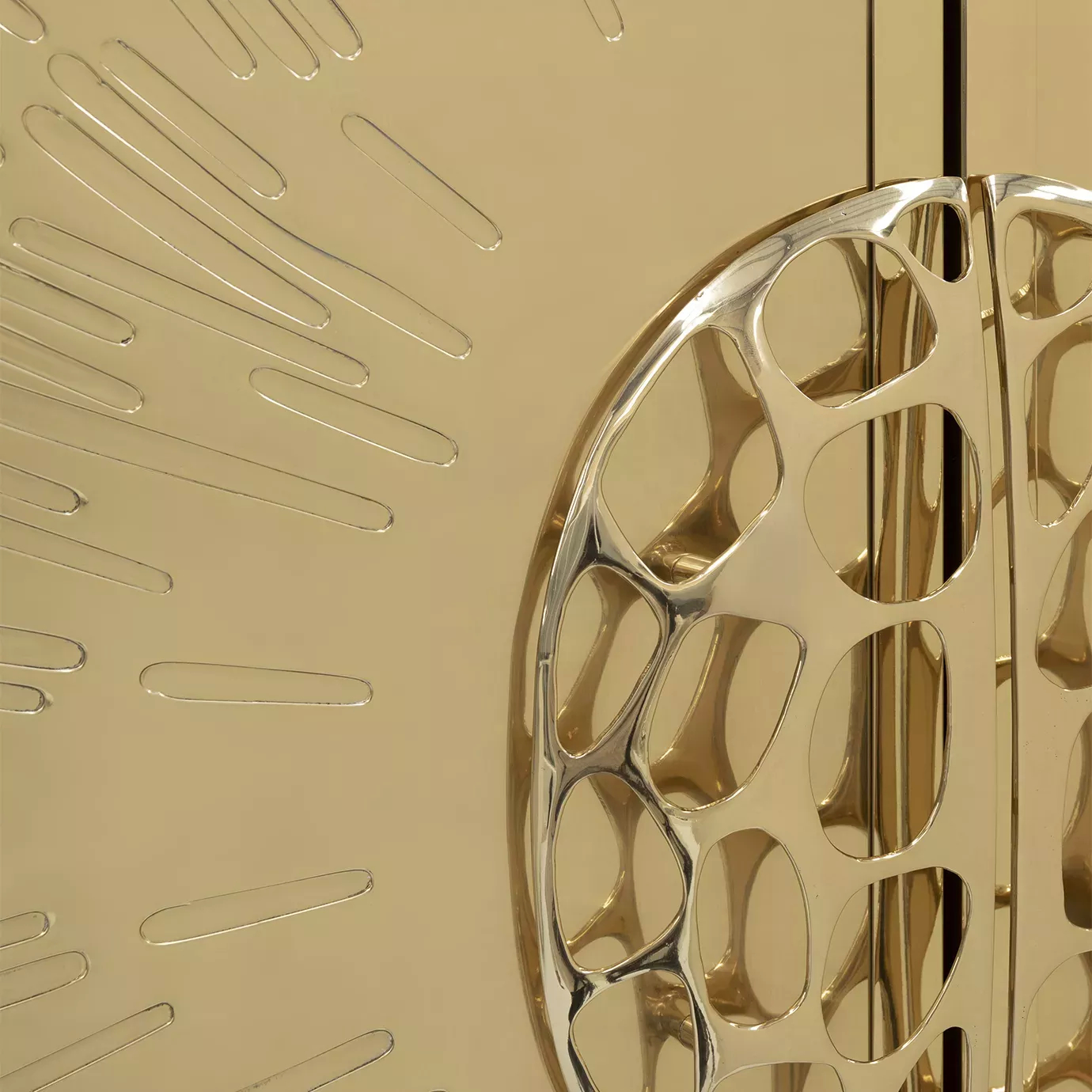 Luxurious detail of the golden Heive armoire handle