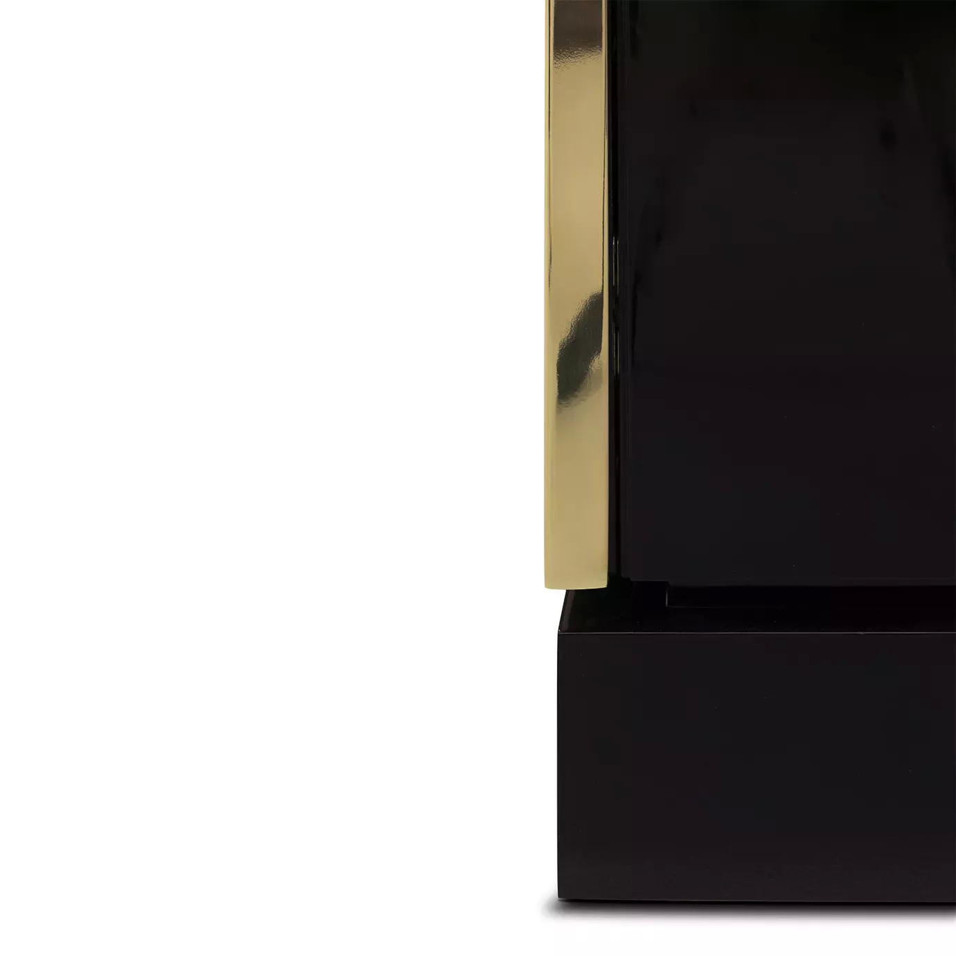 Detail of the golden frame of the black Heive armoire.