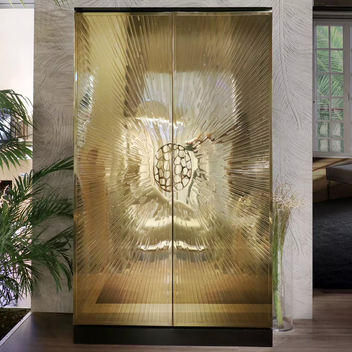 Luxurious golden Heive armoire, a centerpiece of interior design.