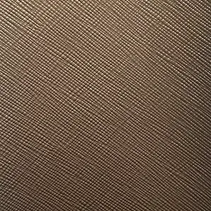 A close-up of Nomad Synthetic Leather shows a finely textured surface with a subtle, diagonal cross-hatch pattern in a warm, neutral tone.