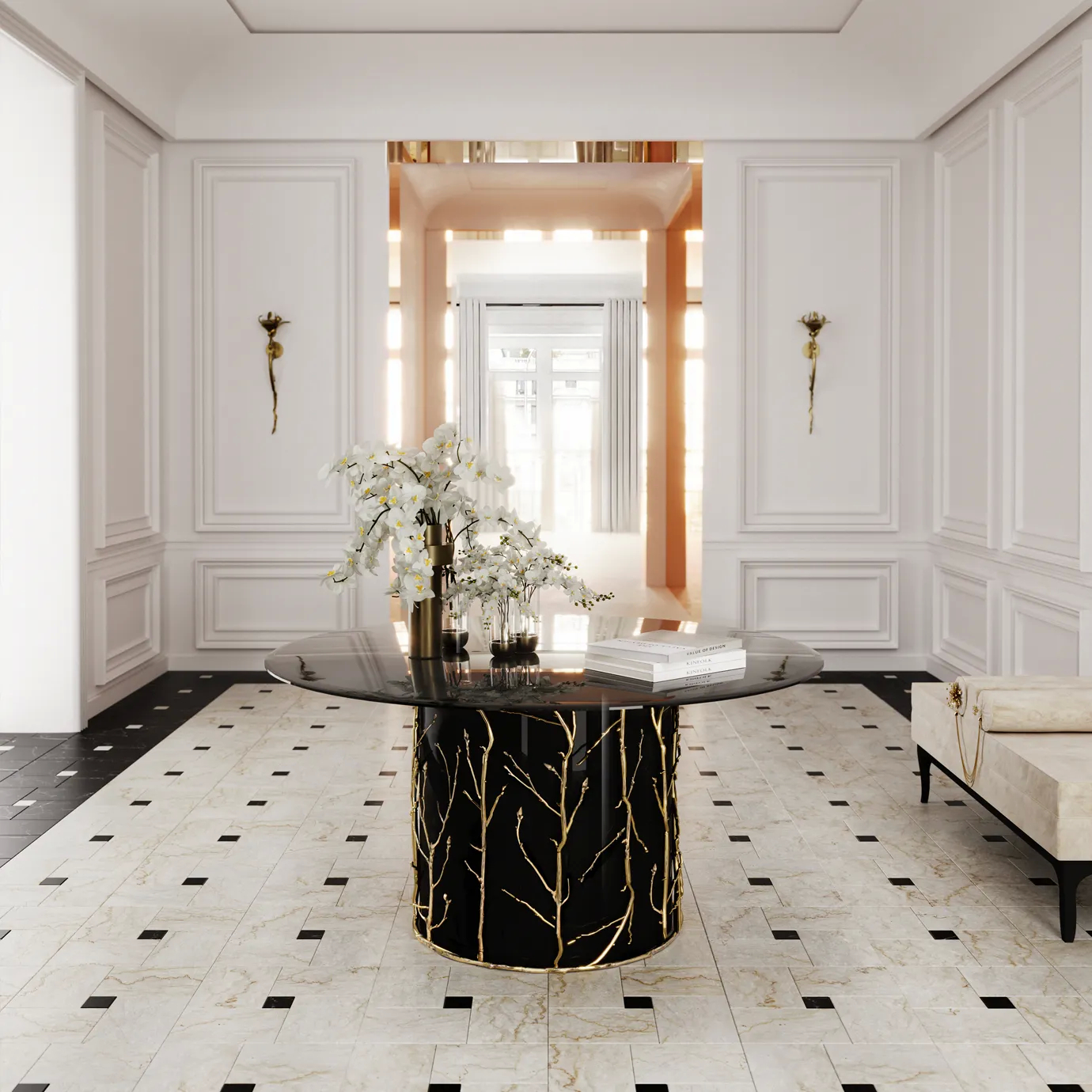 Big neutral colored entryway with an Enchanted Glass Top Dining Table in the center. The Enchanted Glass Top Dining Table features a smoked glass tabletop and has a black structure adorned with intricate aged brass details, resembling branches. Above the table, there are white flowers and some books. In the background, there are 2 golden sconces.