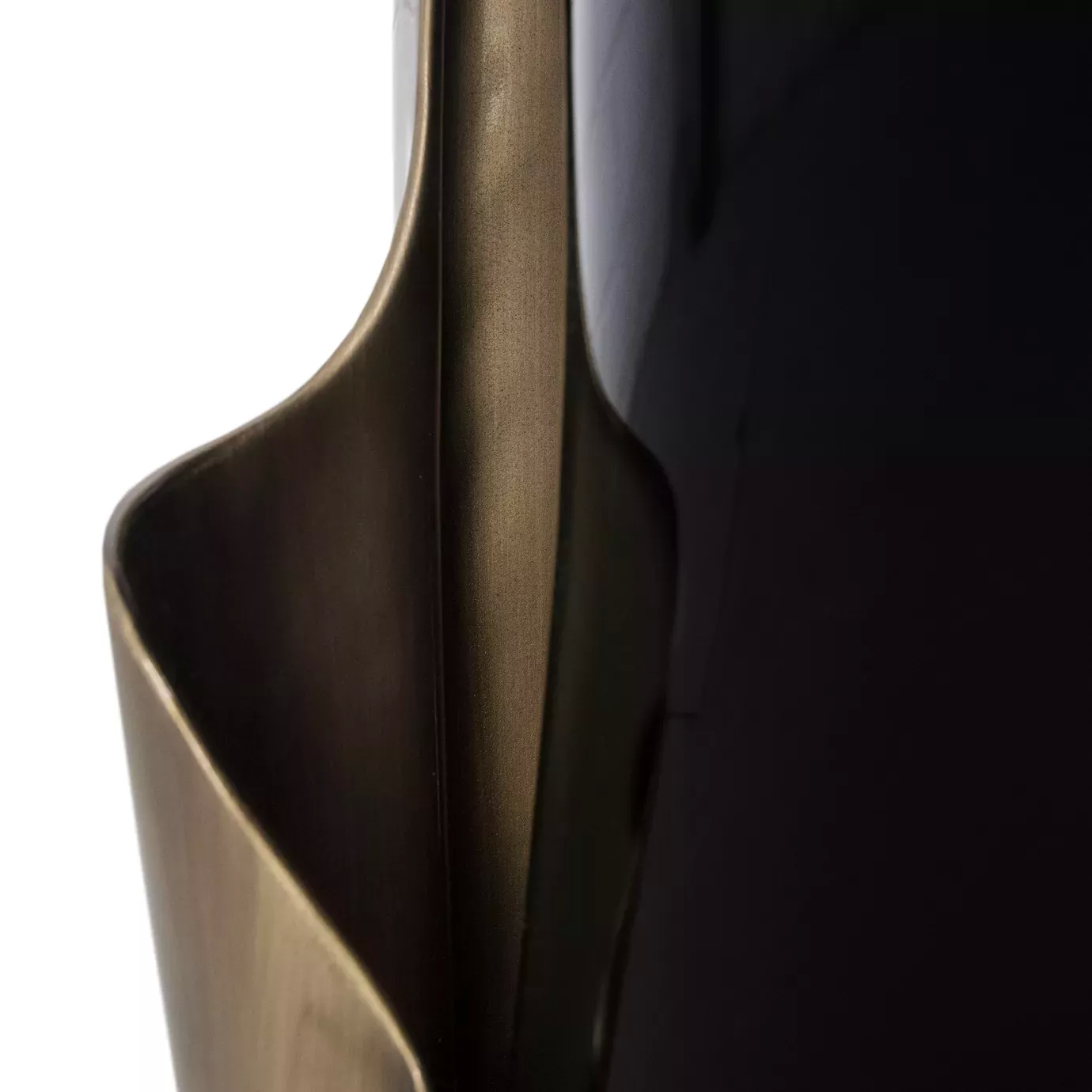 Detailed view of the Yasmine Aged Gold Leaf Side Table’s black base, surrounded by an aged gold leaf structure.
