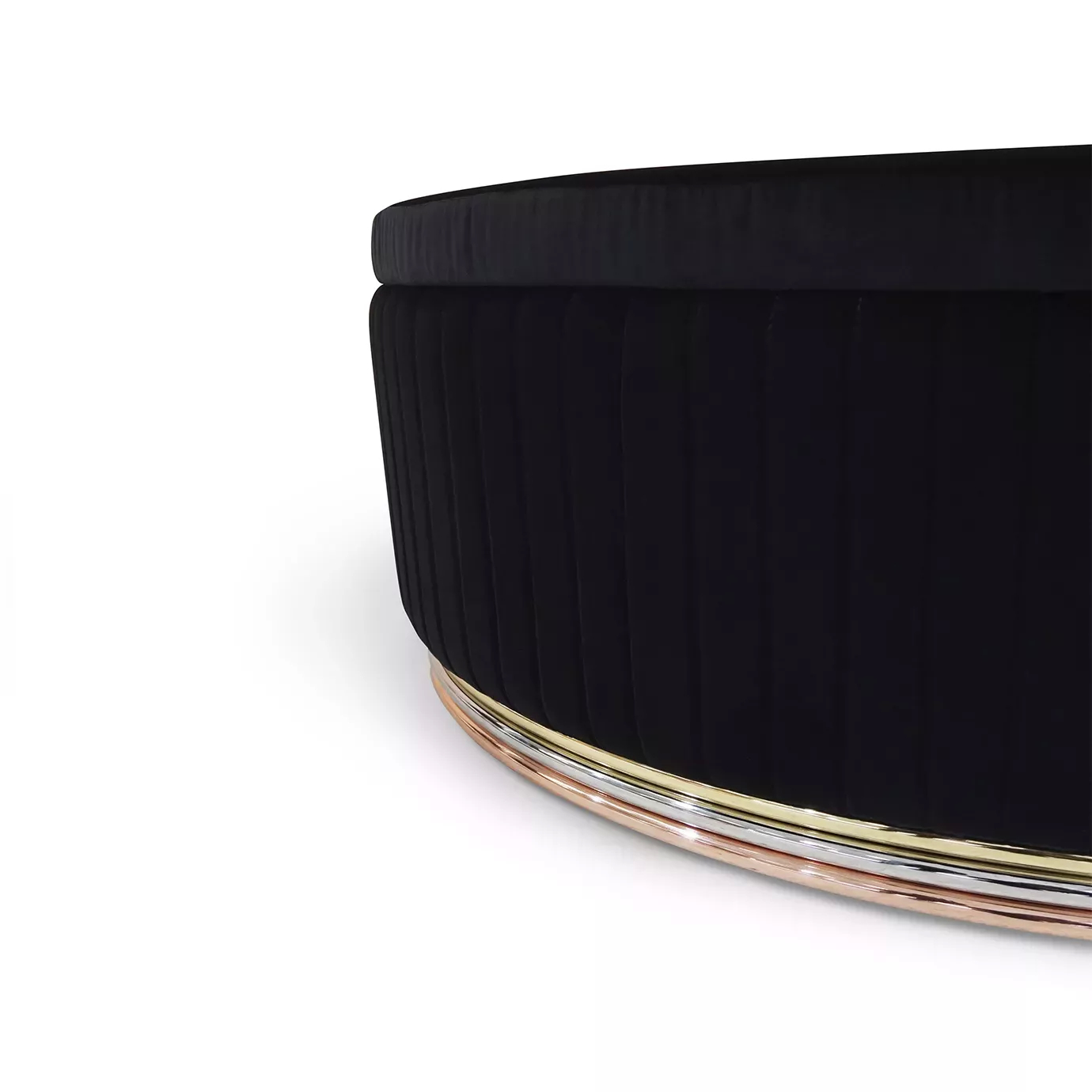 Mia Ottoman: Close-up of the base, highlighting the rose gold trim and black pleated fabric detail.