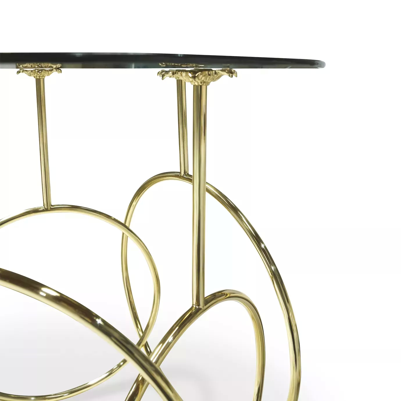 Elegant close-up of the dark glass top and sculptural golden base of the Kiki Side Table.