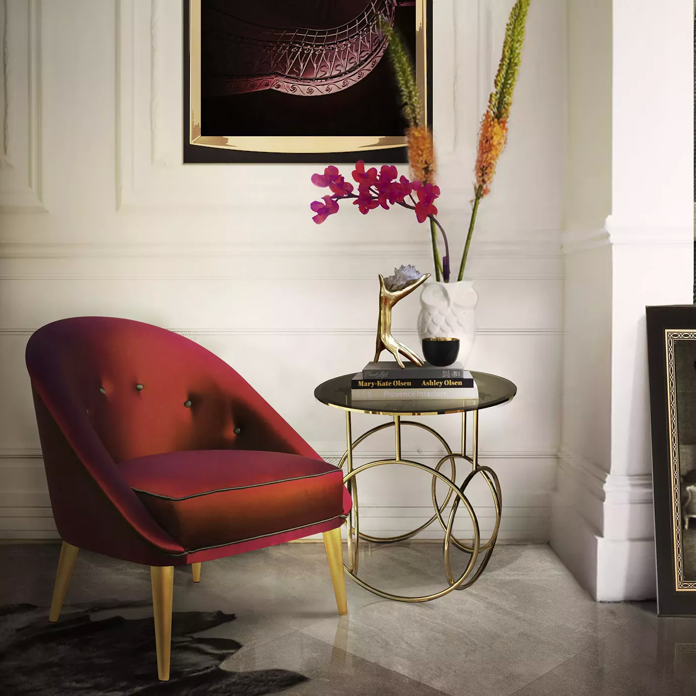 Elegant golden Kiki Side Table with dark glass top next to a luxurious fabric chair in a modern setting.