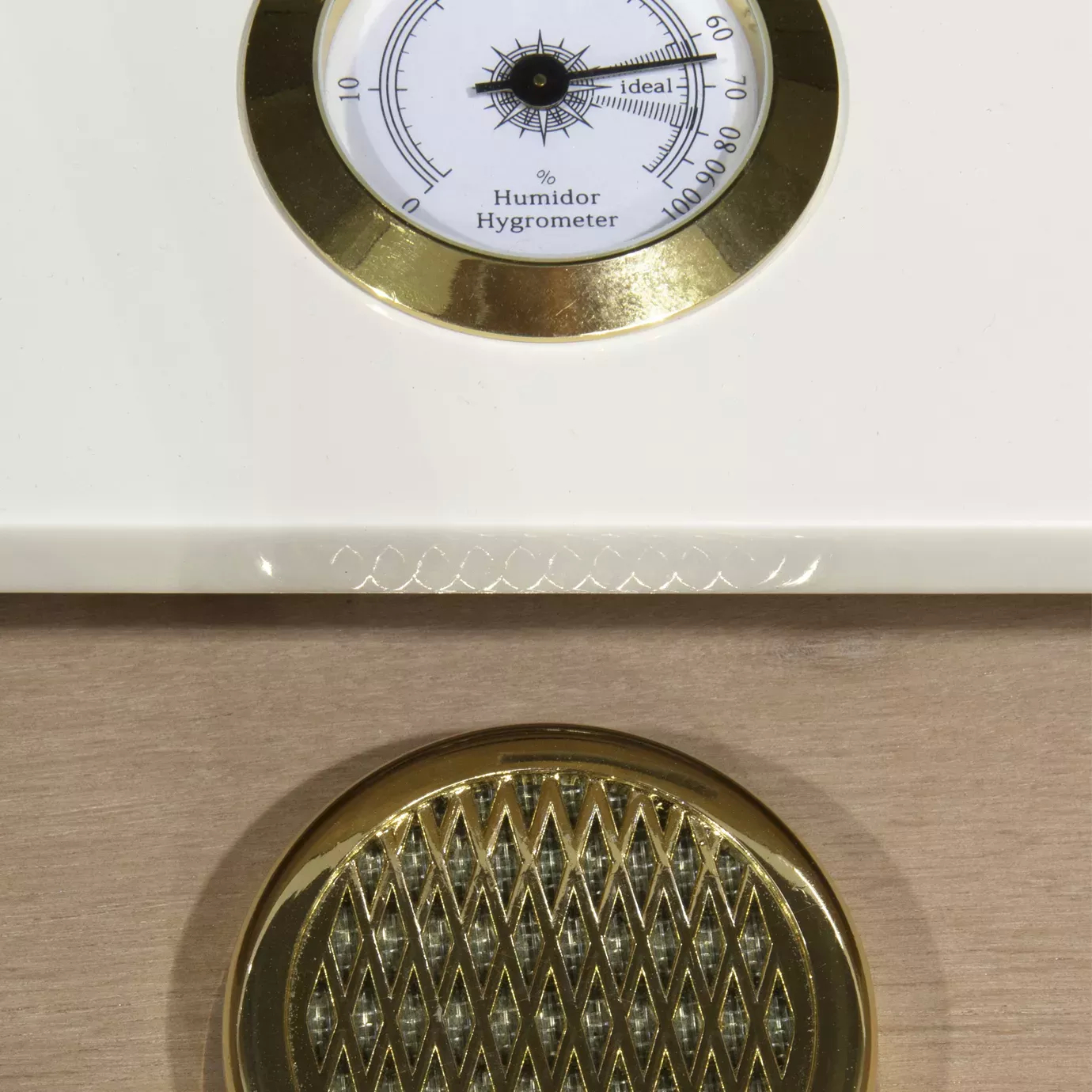 Detailed view of the Humidor Hygrometer incorporated on the Spellbound Lacquer Bar Cabinet, to help keep your beverages in its best conditions.