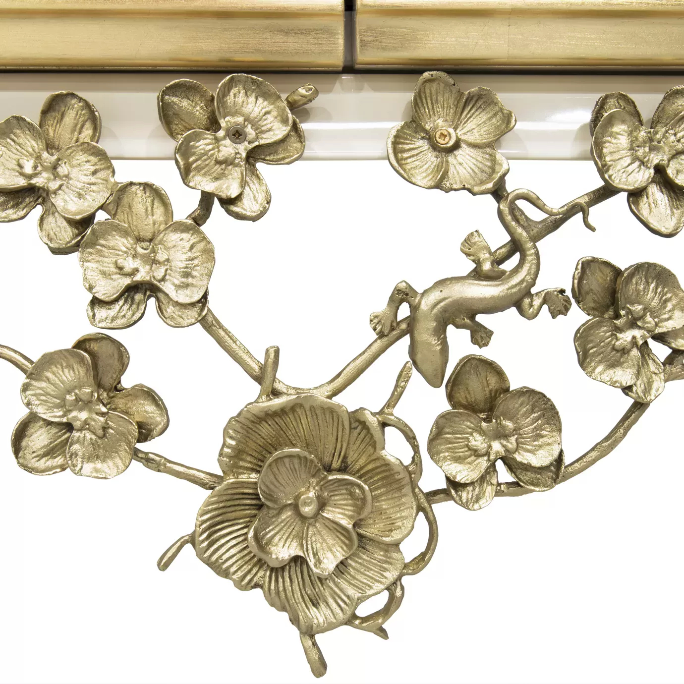 Spellbound Lacquer Bar Cabinet: Detailed view of the floral motif metal lace, in golden shades, creating an elegant contrast with the creamy structure.