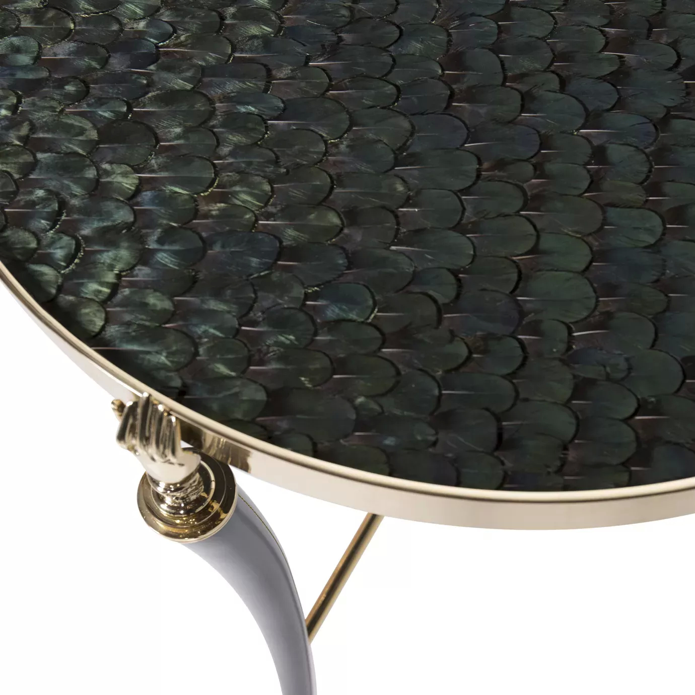 Elegant close-up of the peacock feather pattern top and golden hand detail of the Gisele Side Table.