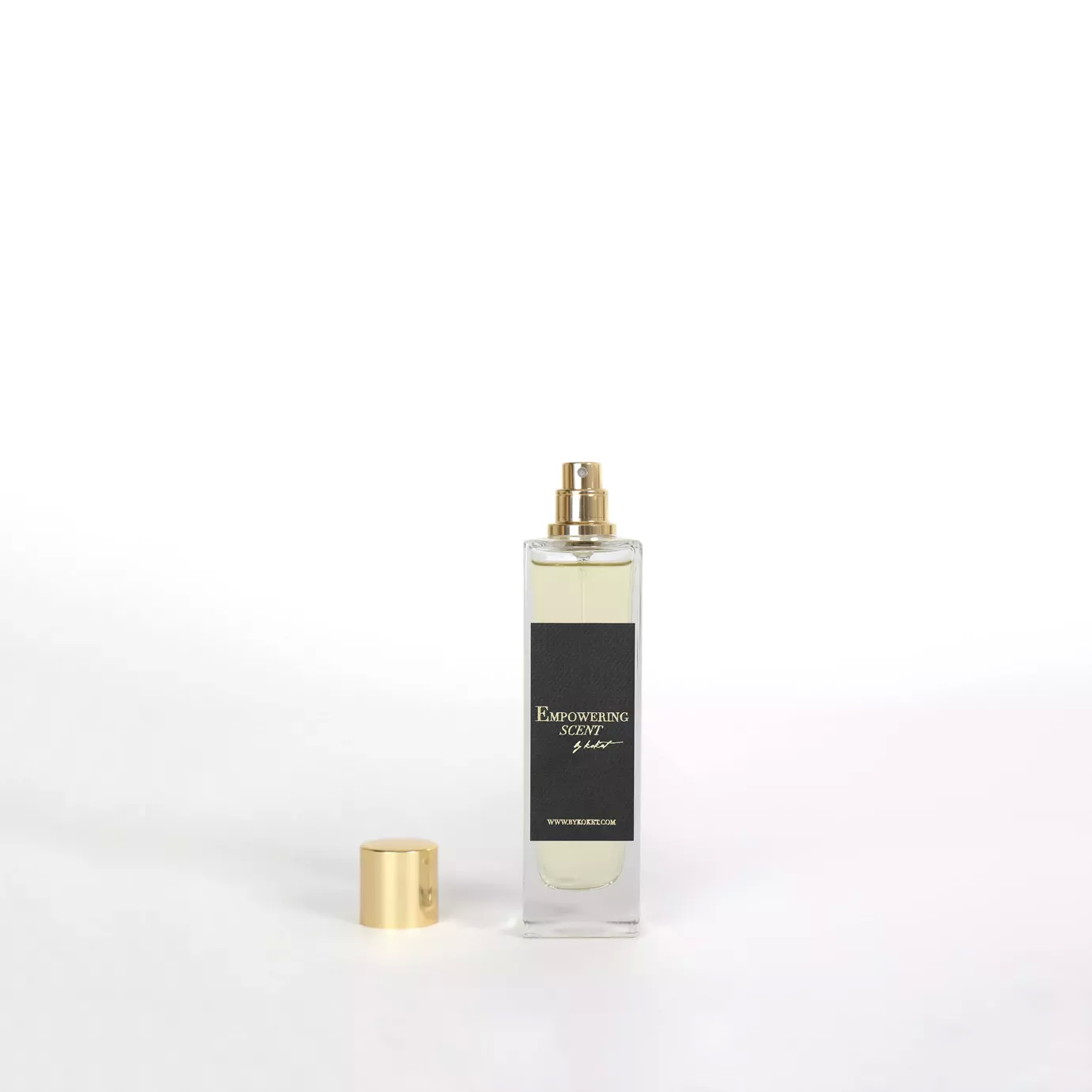 Empowering Scent: A rectangular glass perfume bottle with a gold cap and a black label.
