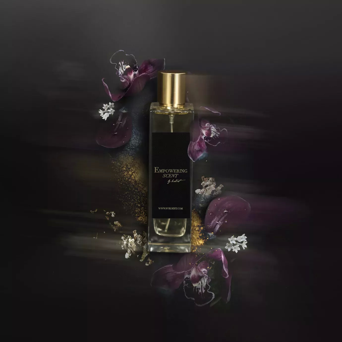Empowering Scent perfume: clear bottle with gold cap, surrounded by dark flowers.