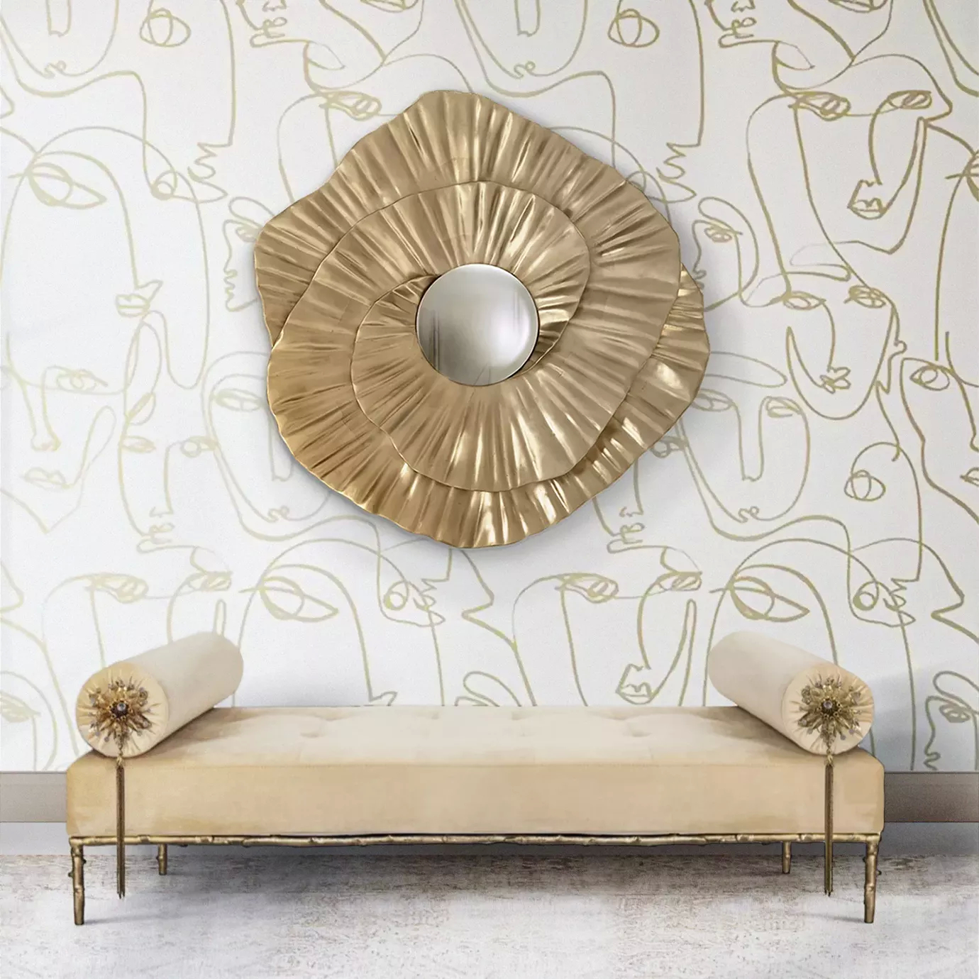 Privê Bench in a room with a golden, swirling mirror on a patterned wall, and decorative bolster pillows with tassels.