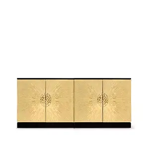 Heive Cabinet featuring four golden doors with radiating patterns and central textured circular handles, on a black base and top.