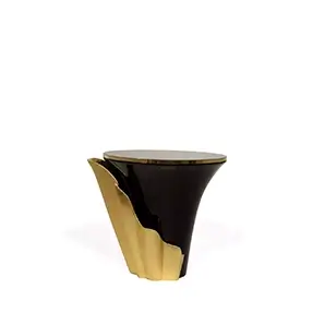 Featuring a sultry silhouette, Yasmine Side Table has a black marble tabletop with golden edges, set on a solid wooden black base, adorned with a golden structure that arches back and forth.