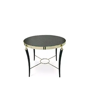 Gisele Side Table with a round, dark patterned top, a golden rim, and black legs with golden accents.