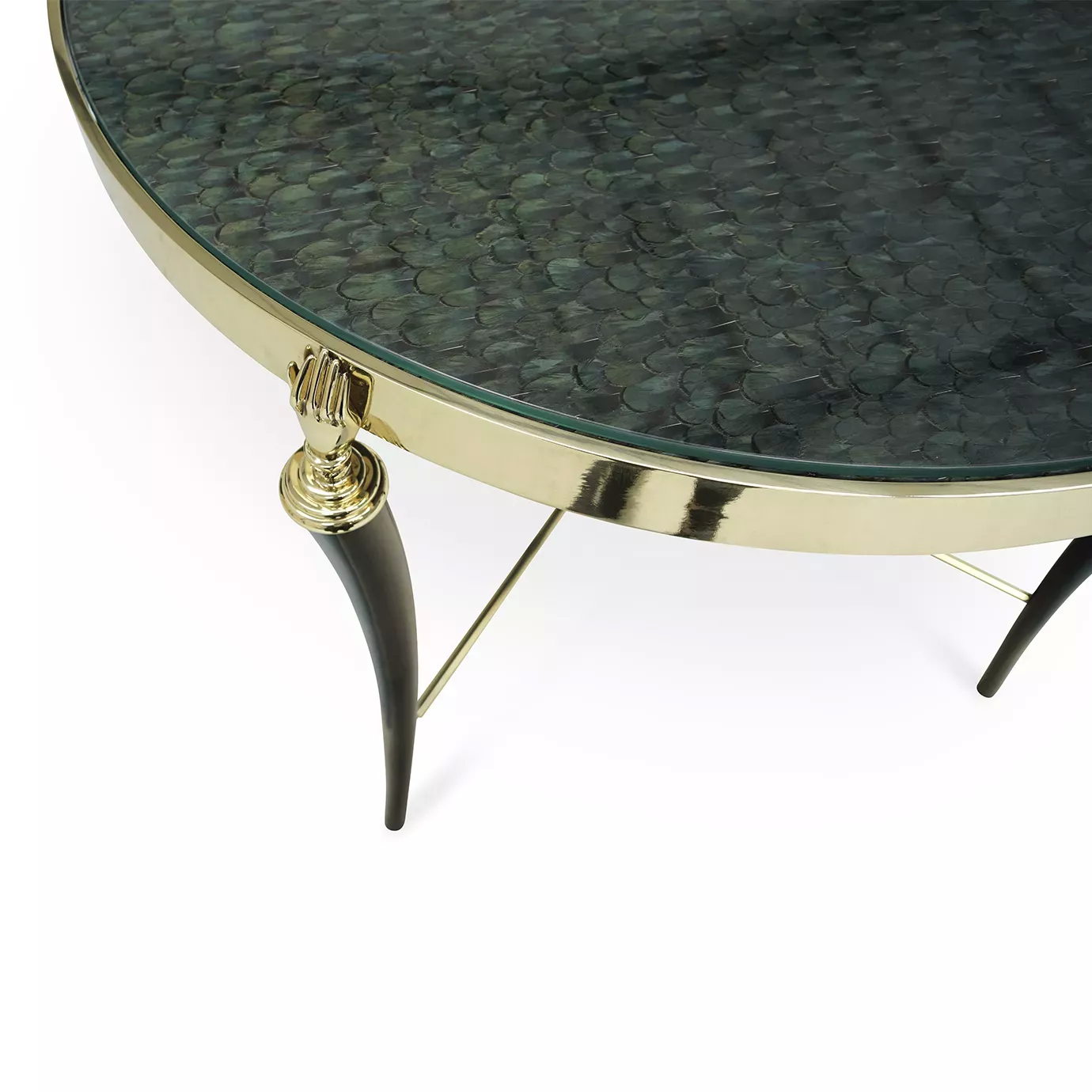 Close-up of the Gisele Peacock Feather Side Table, showing its patterned green feather top, golden rim, and black leg with a golden hand detail.