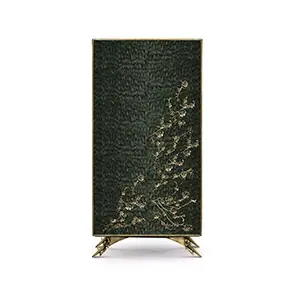 The Spellbound Peacock Feather Armoire’s structure is adorned with green peacock feathers ornamented with elegant golden flower-shaped details along the bottom of the front doors.