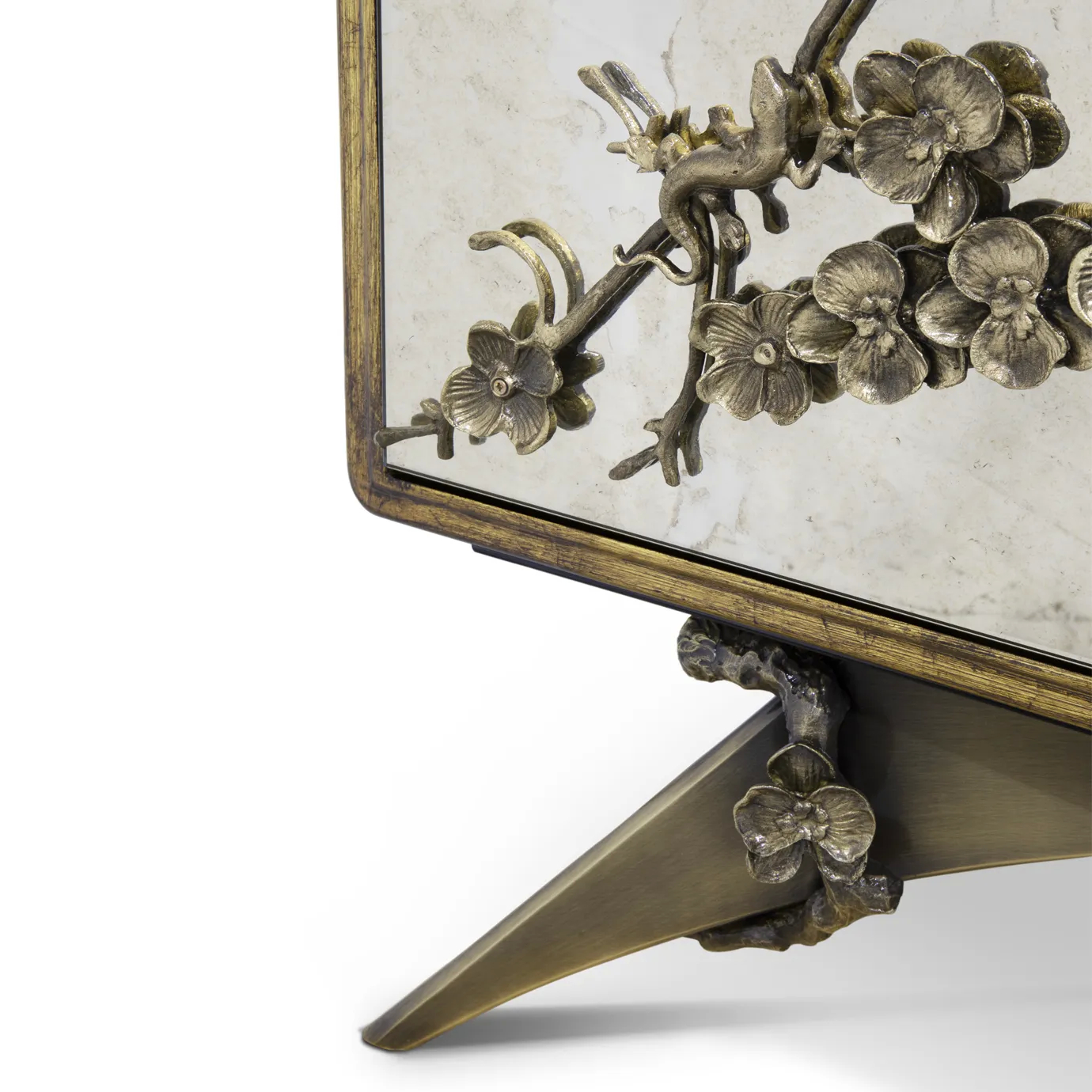 Close-up of the Spellbound Aged Mirror Armoire's leg, showcasing its unique, sculptural golden design with branch-like details.