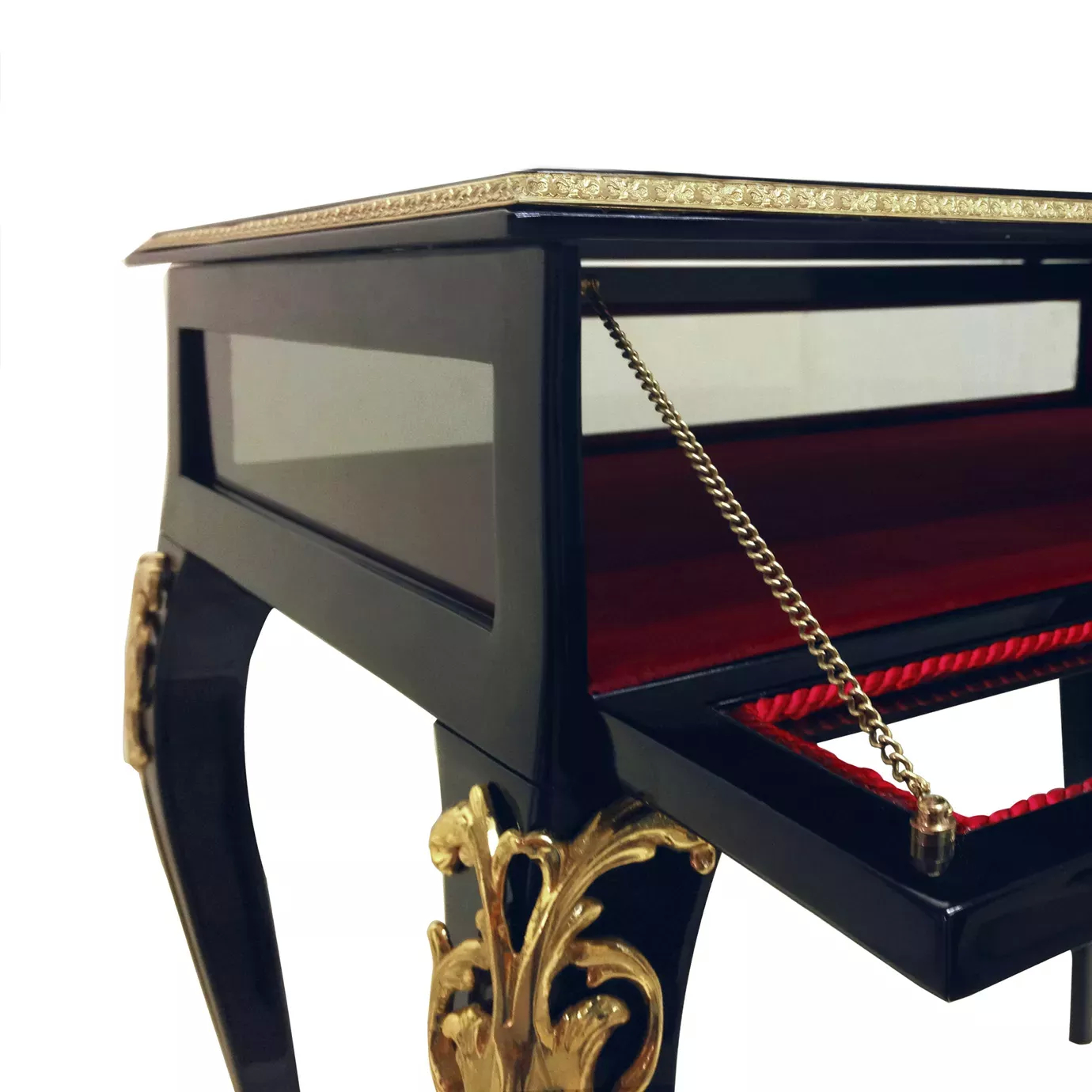 Elegant close-up of the open drawer with red interior and golden chain of the Cabriole Nightstand.