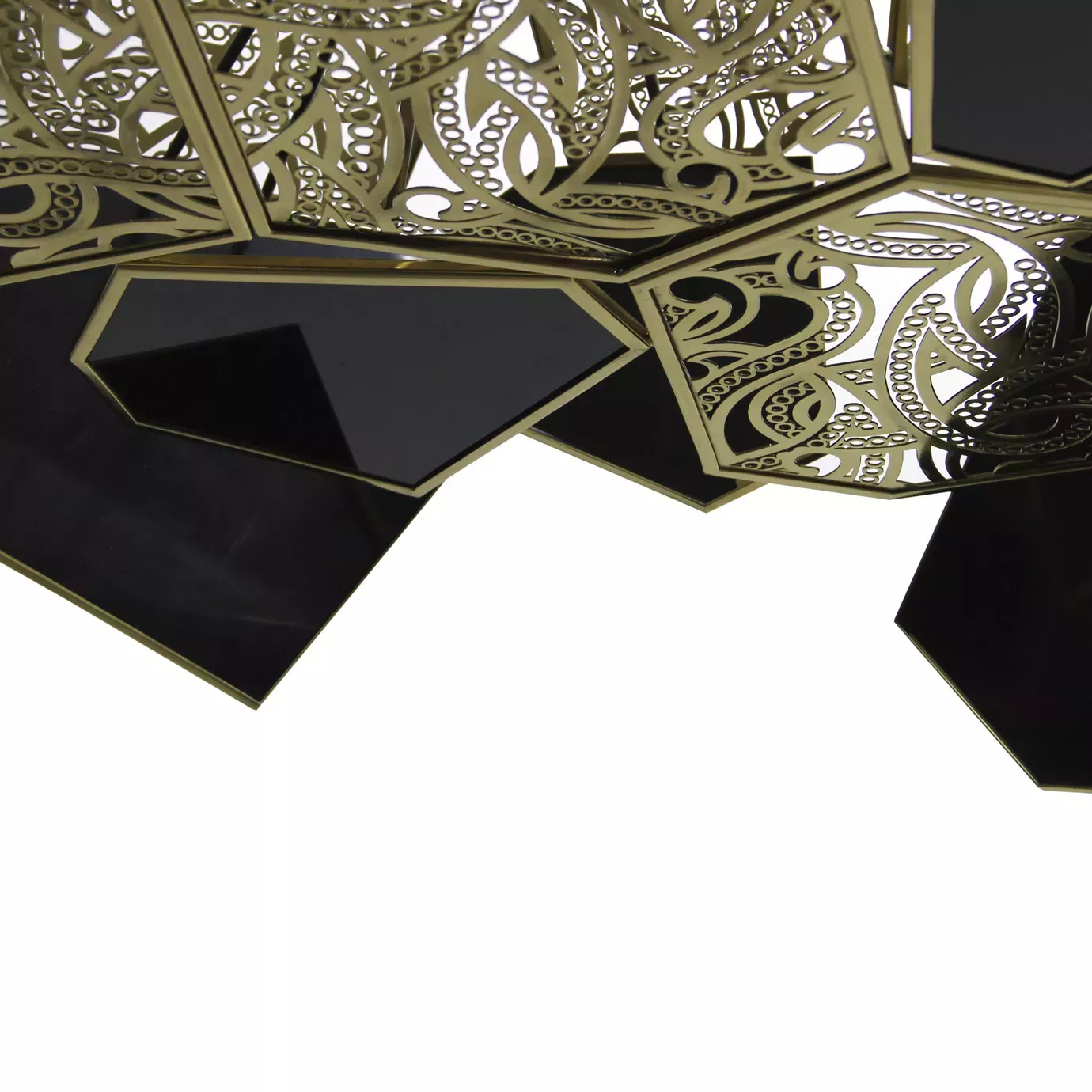 Close-up of the Hypnotic Lacquer Chandelier, highlighting the intricate golden metalwork and glossy black lacquer geometric shapes.
