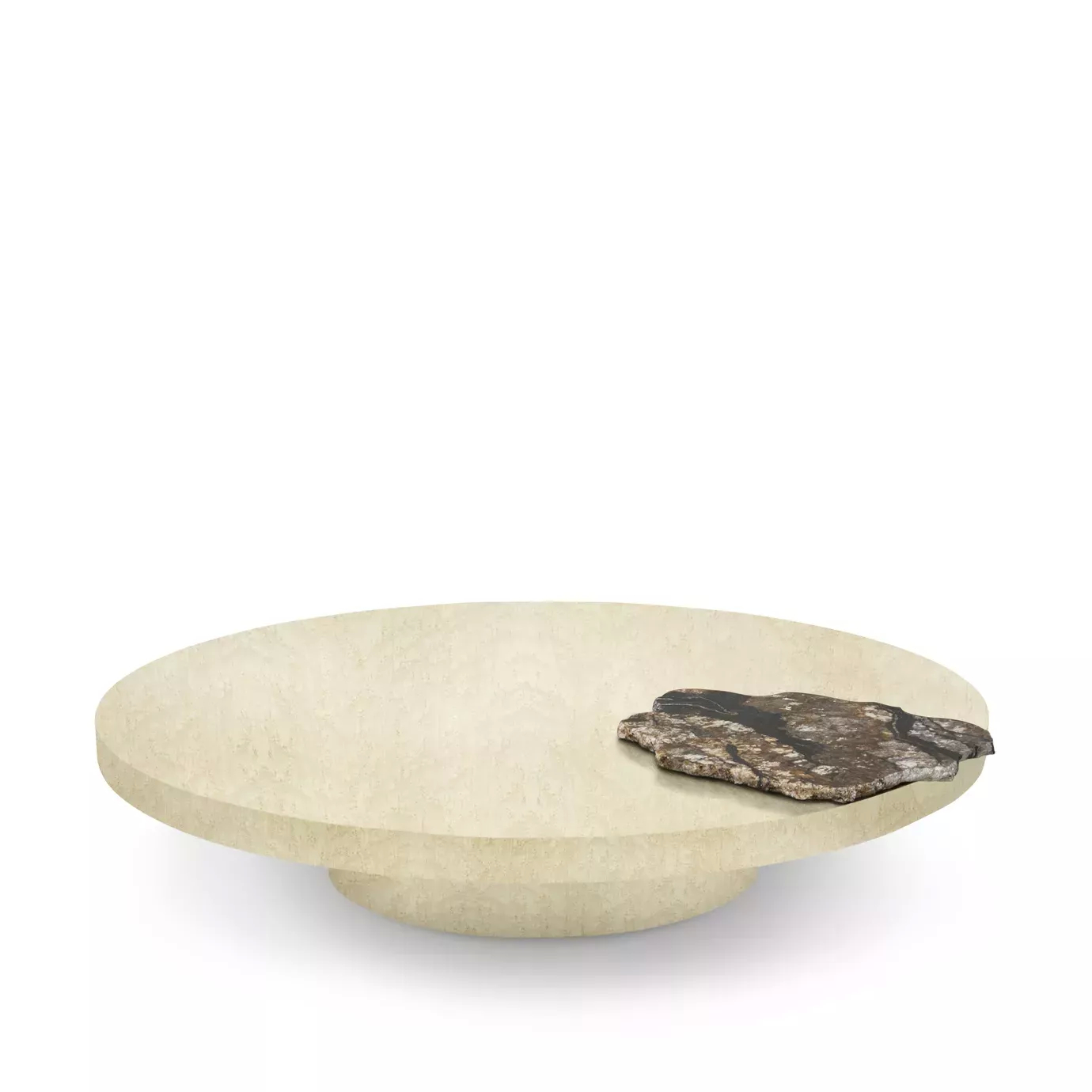The Mineral Coffee Table showcases a round, textured light stone surface with a unique, contrasting dark stone detail on top.