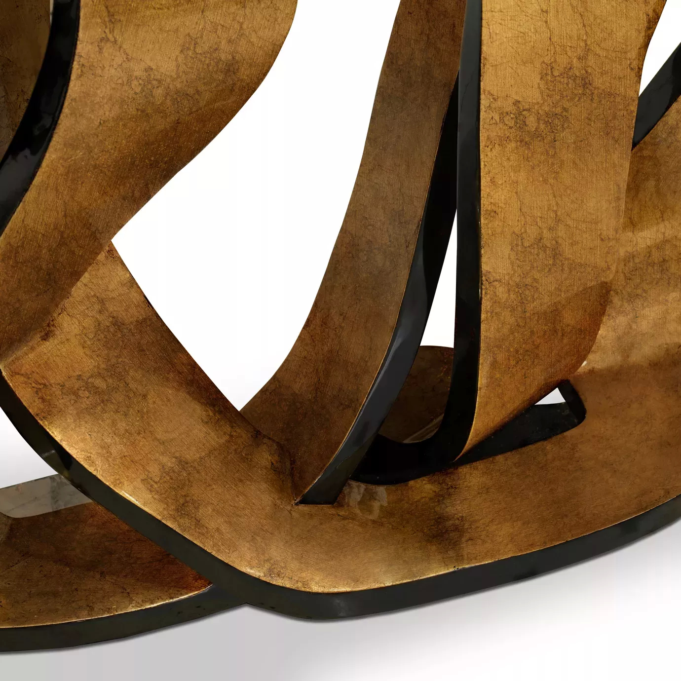 Detailed perspective of the luxurious Ribbon Broken Copper Leaf Console’s copper base, demonstrating its twists and turns.