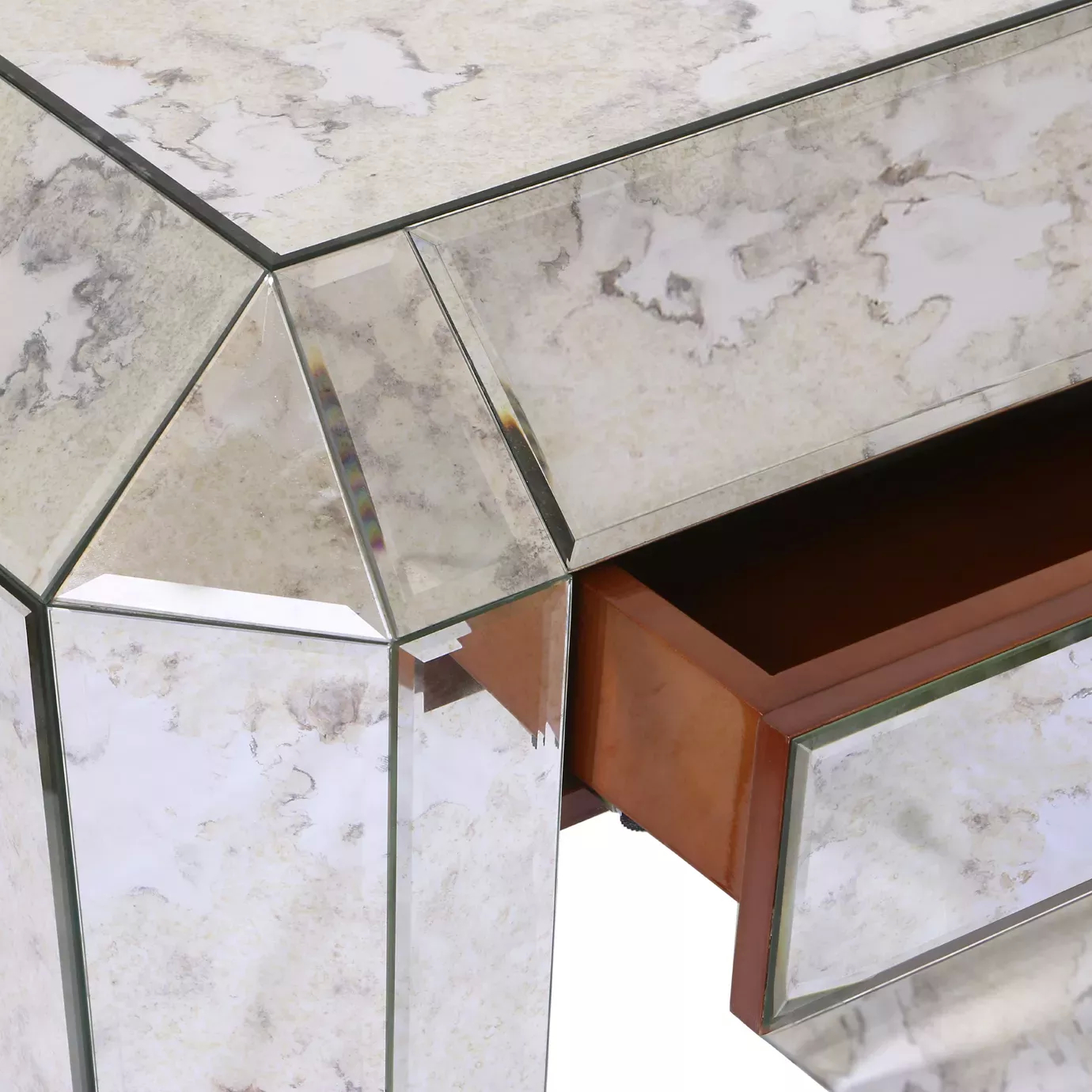Elegant close-up of the mirrored geometric design of the Tamara Nightstand.