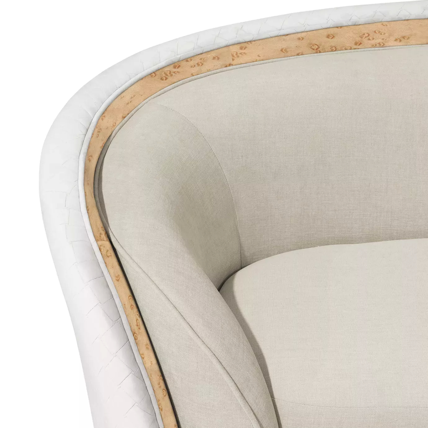 Close-up on the Sultana Sofa's armrest, featuring light-colored fabric, quilted side panel, and a decorative wooden trim.