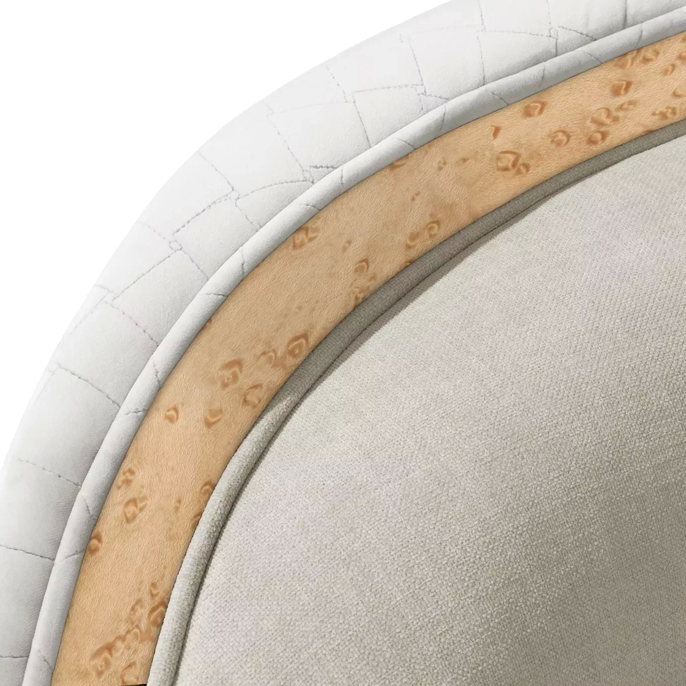 Tight close-up of the Sultana Sofa, highlighting the textured light fabric, quilted side detail, and smooth wooden trim.