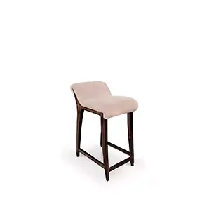 Slightly angled view of the Incanto Counter Stool: featuring a light pink, plush upholstered seat and dark wooden legs.