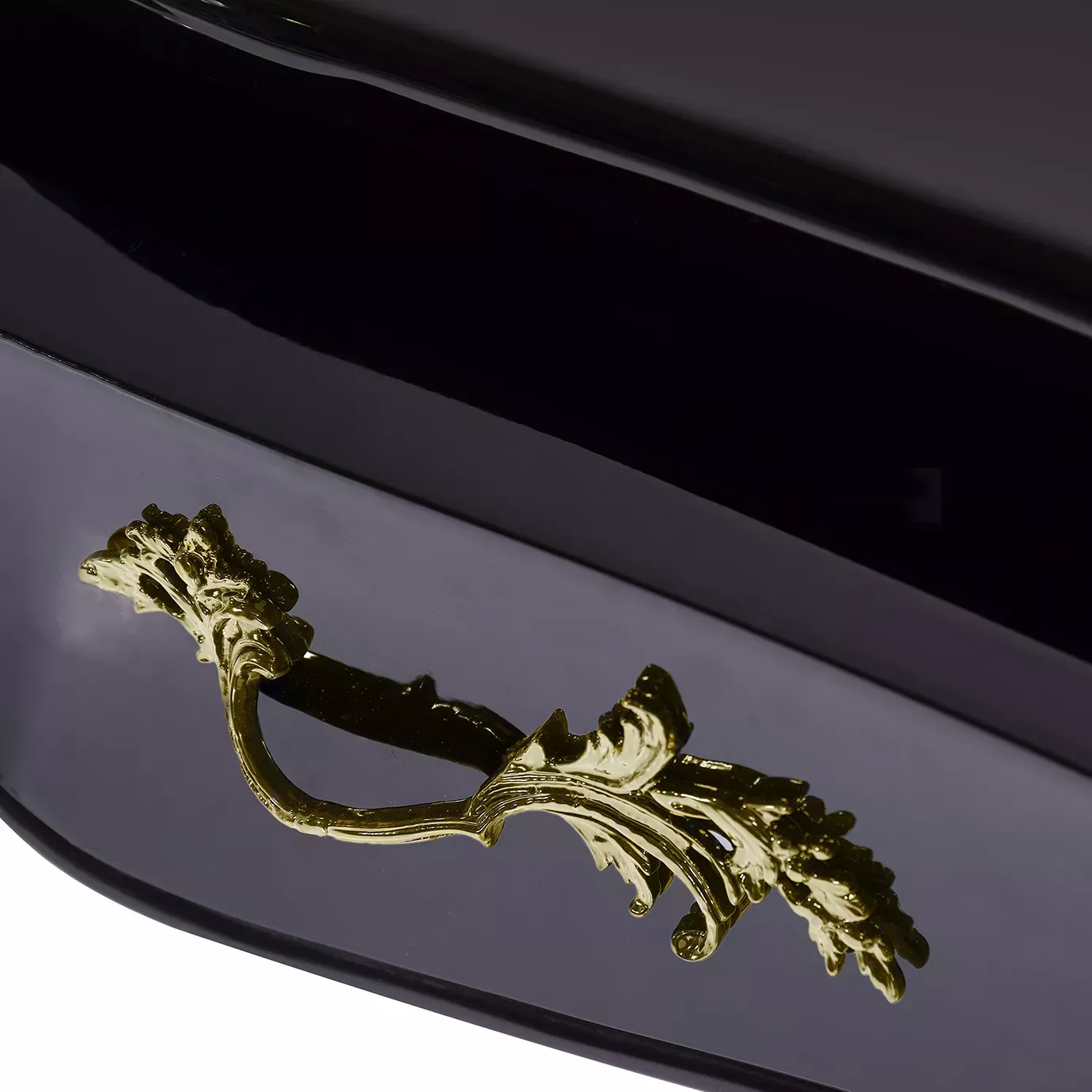 Close-up of the Exotic Lacquer Top Ormolu Desk, showcasing its exquisite gold hardware and glossy black finish.