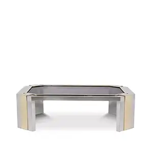 Minx Coffee Table with glass top and geometric stainless steel base with golden details.