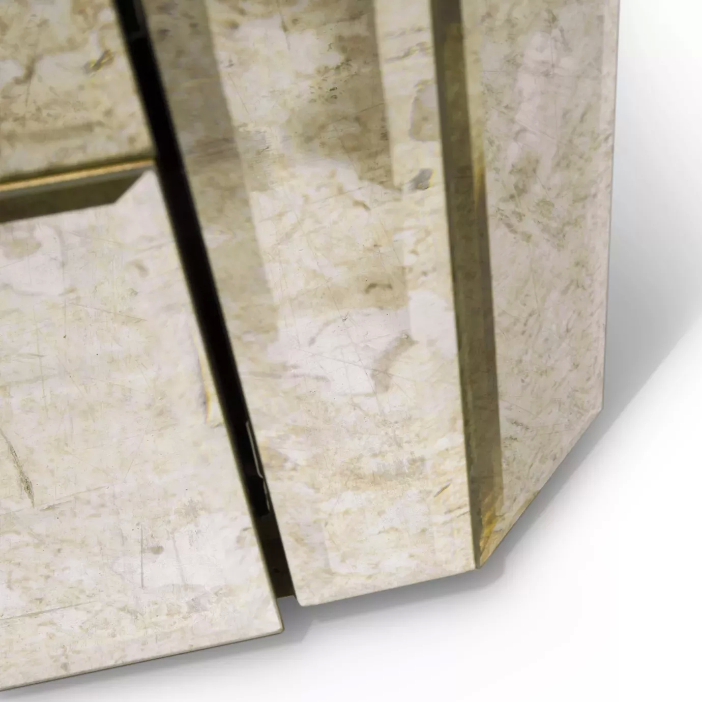 Close-up of the Tamara Chest base, highlighting its mirrored finish and the elegant metallic trim that outlines its geometric design.