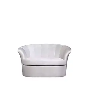 Front view of a stylish white velvet Cocktail Armchair featuring a distinctive, curved shell-like back and plush seating. Its design offers elegance and comfort.