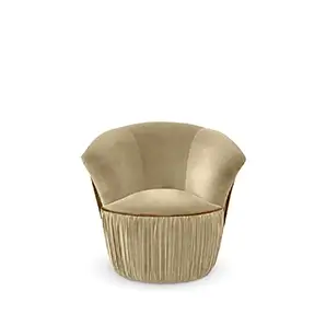 Countess Chair: An elegant, curved armchair in a soft beige velvet with a distinctive pleated skirt and wooden trim.