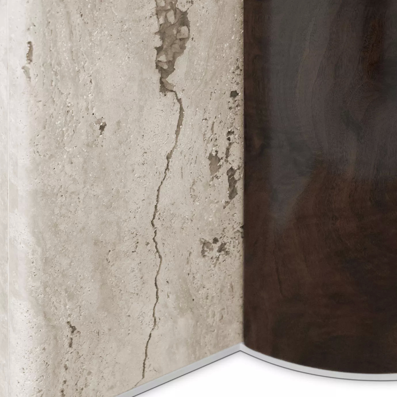 Paris Oval Dining Table, base close up: A detail showing the contrast between the textured, light travertine marble and the smooth, dark wood veneer.