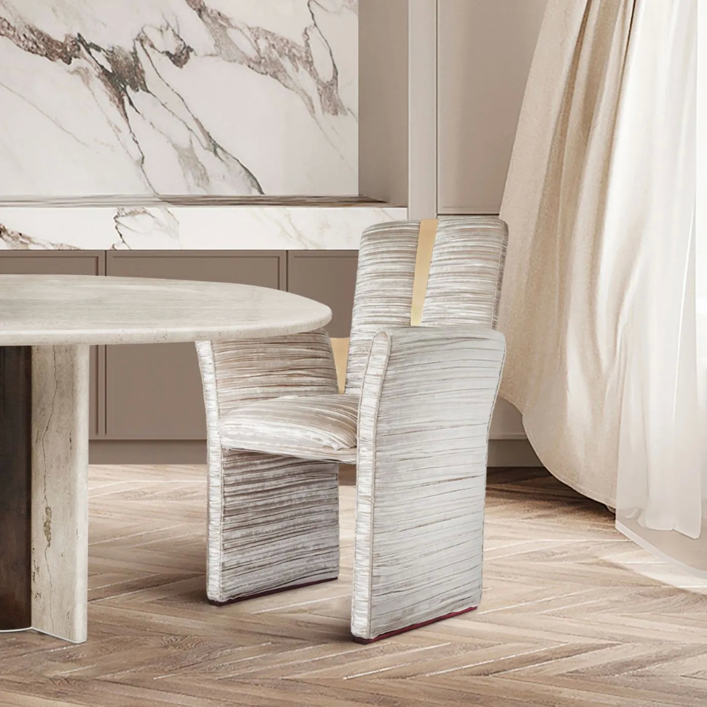 Estelle Dining Chair by KOKET with elegant vertical-channel upholstery and brass accent, placed next to a marble dining table in a modern luxury interior.
