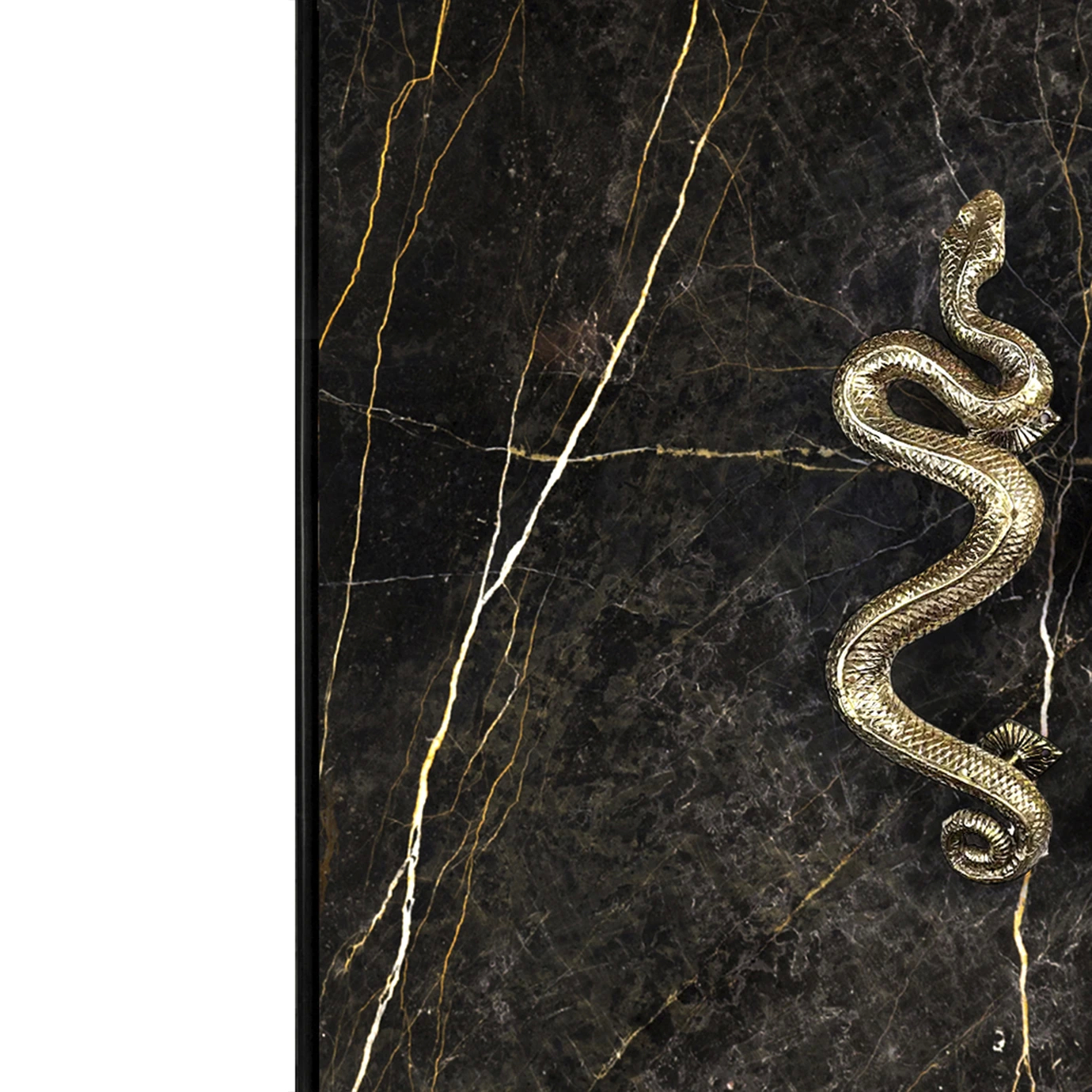 Close-up of the India Bar Cabinet handle, featuring a detailed golden serpent design against the black marble with gold veining.