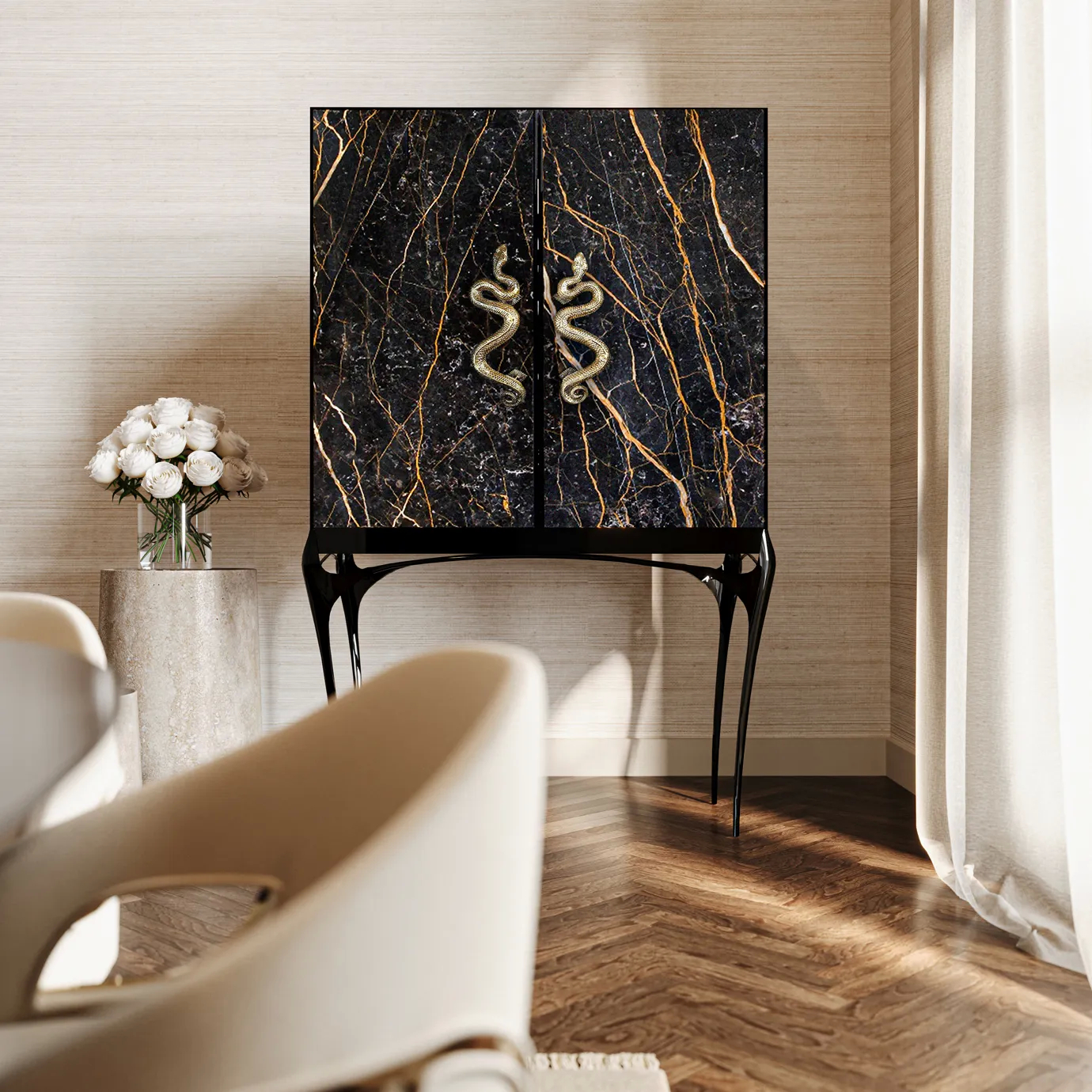 India Port Laurent Marble Bar Cabinet, with its striking black and gold marble and serpent handles, adds luxury to the stylish room.