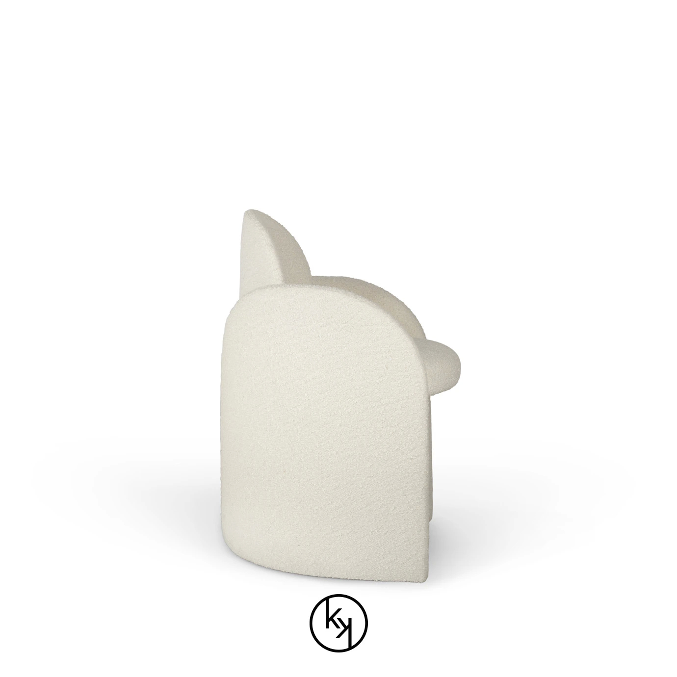Side view of the Oh-lá-lá Chair, highlighting its soft, textured white upholstery and distinctive, continuous curved silhouette.