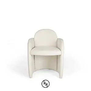 Front view of the Oh-lá-lá Chair, showcasing its soft, textured white upholstery and unique, embracing curved design.