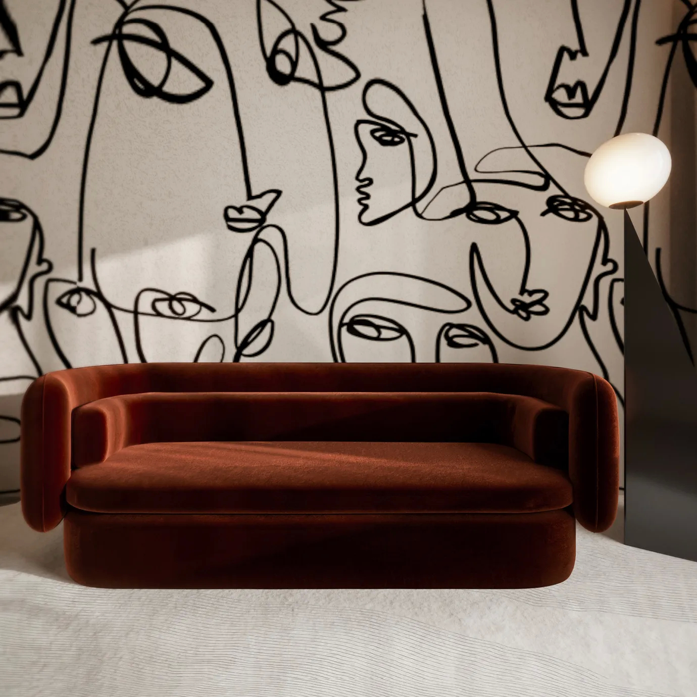 The Deb Sofa, upholstered in rich rust velvet, makes a bold statement against a backdrop of abstract face art wallpaper in a modern room.