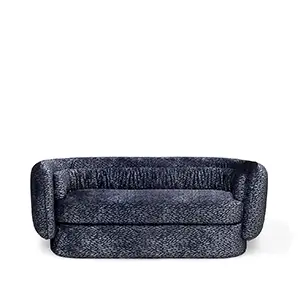 Front view of the Deb Sofa featuring its unique textured upholstery and softly draped detailing along the top.
