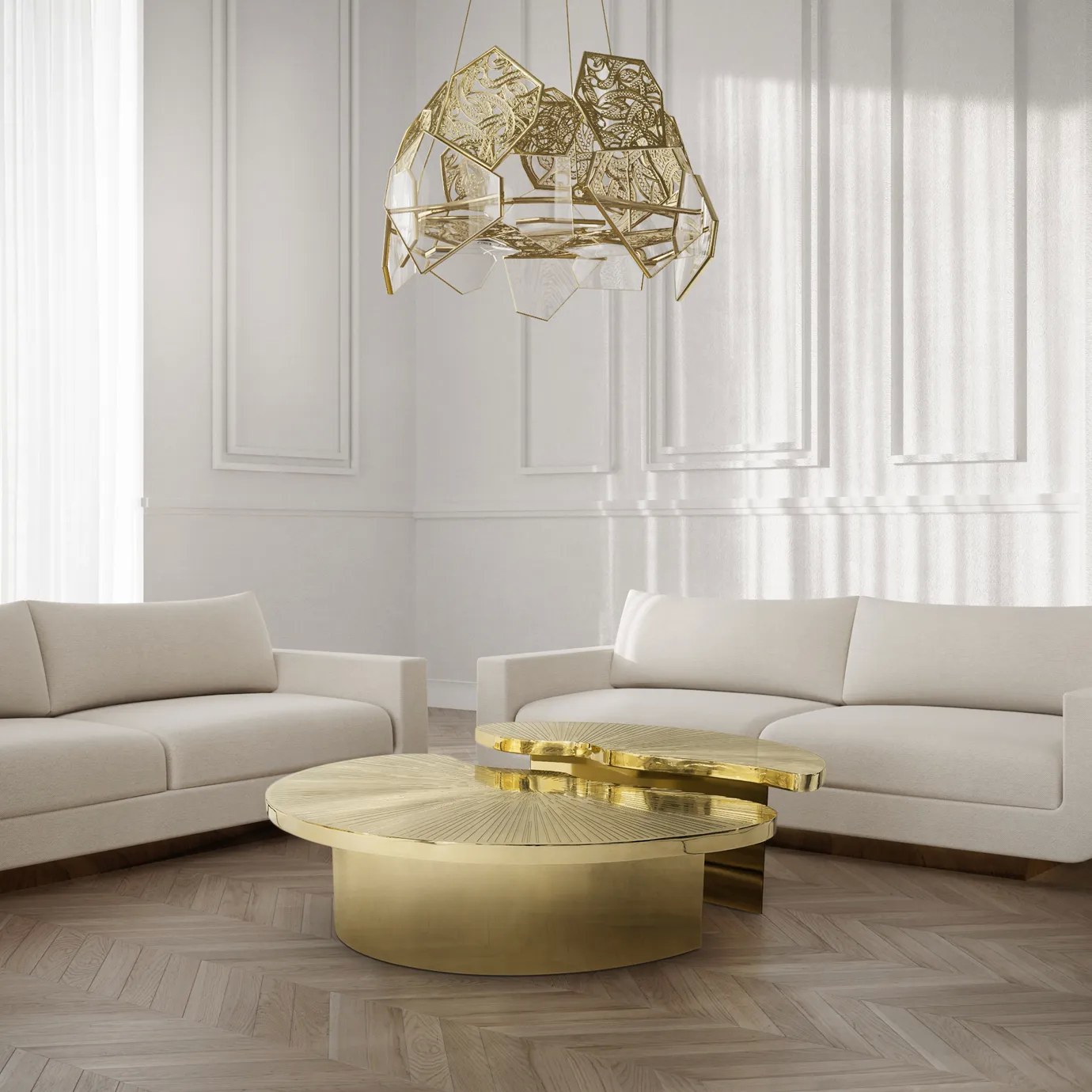 A neutral colored living room, with 2 cream sofas. In the center of the room, there’s a Myth Coffee Table, featuring two individual polished brass parts, in a round shape, set in different heights. Above the table, there’s a golden chandelier.