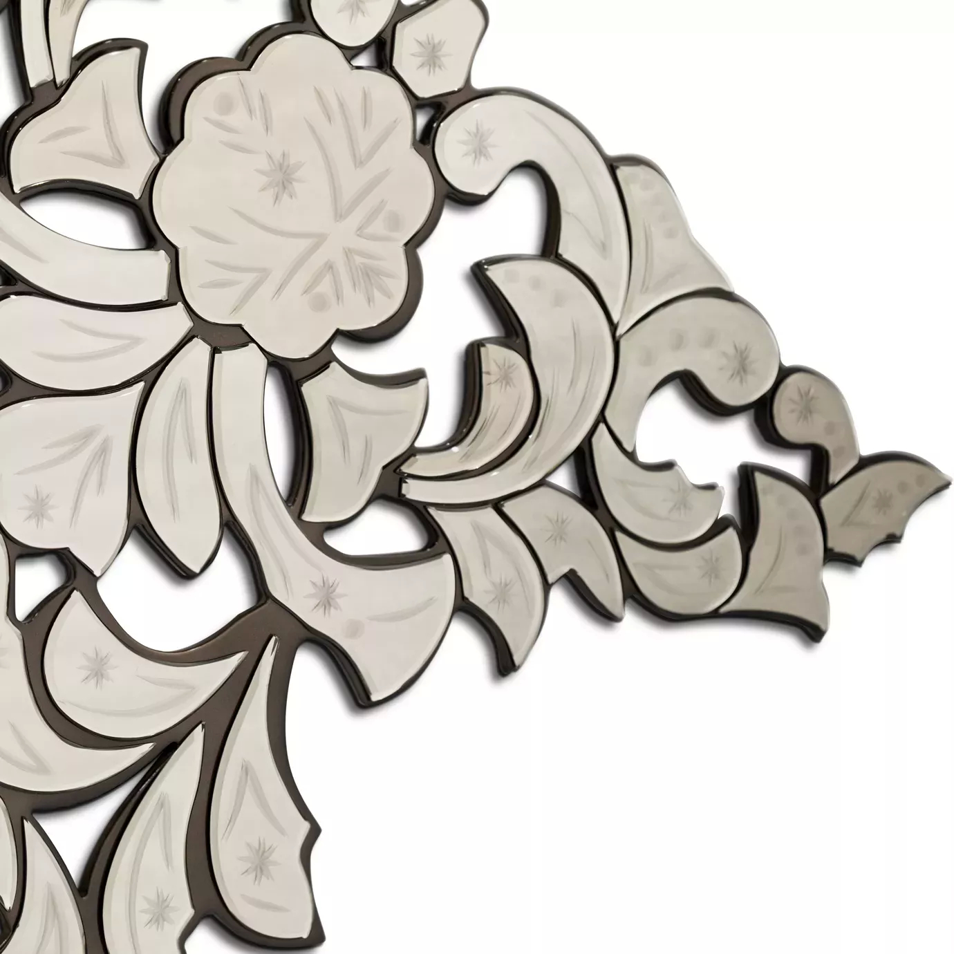 Ornate detail of the Addicta Mirror with floral and arabesque motifs.