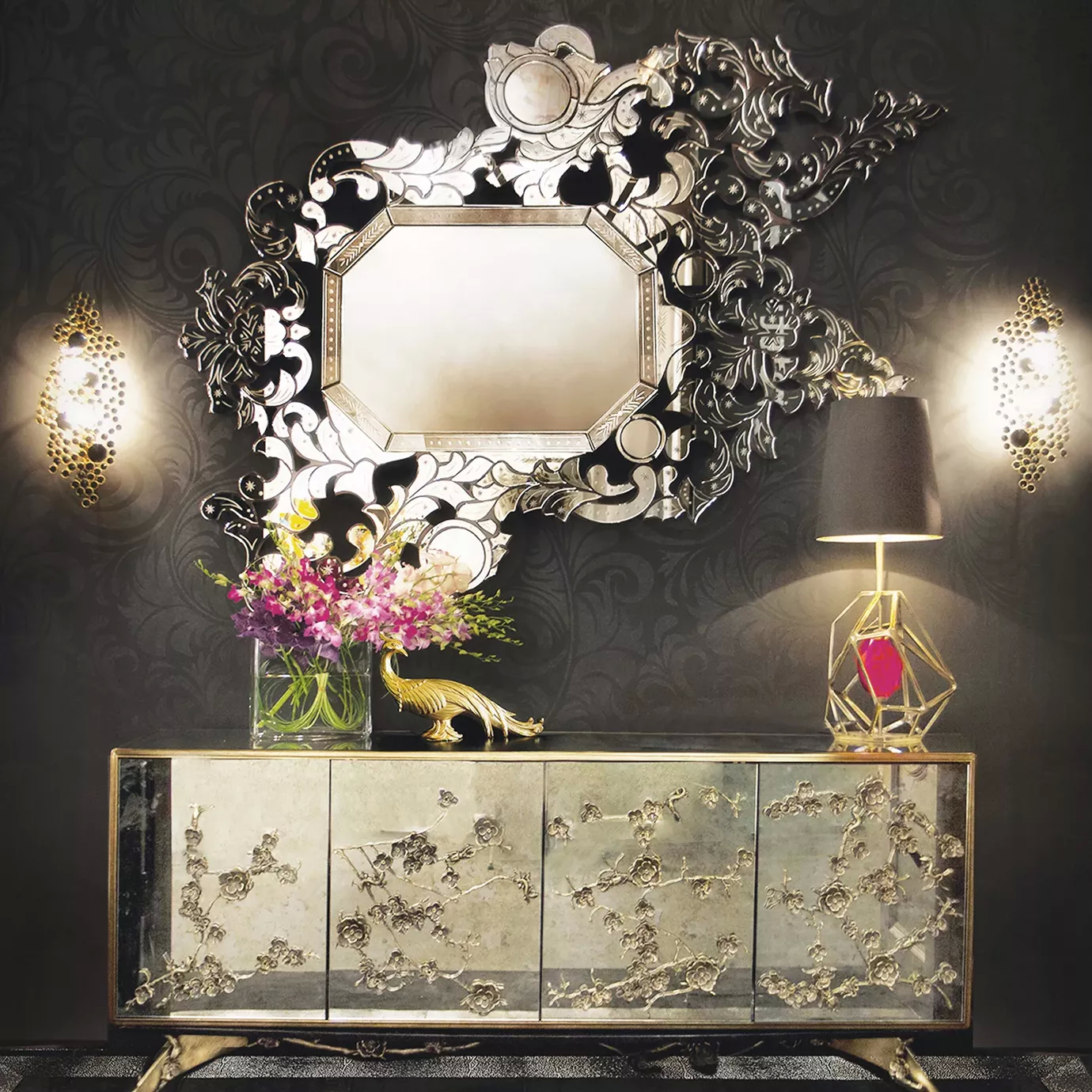Spellbound Aged Mirror Cabinet under the ornate Addicta Mirror on a dark textured wall.